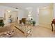 Inviting living room with tiled flooring, stylish furniture, and an open layout to a dining area at 4025 Luan Dr, Orlando, FL 32808