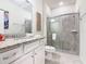Bathroom features granite countertops, a vanity sink, and a glass-enclosed shower at 4098 Lana Ave, Davenport, FL 33897