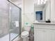 Bathroom includes a walk-in shower with tiled walls, modern fixtures, and ample vanity storage at 4098 Lana Ave, Davenport, FL 33897