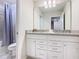 Bathroom with double vanity sinks, granite countertops, and a shower and bathtub combo at 4098 Lana Ave, Davenport, FL 33897