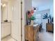 Bright bedroom view showcases neutral decor, a cozy queen bed, and ensuite bath at 4098 Lana Ave, Davenport, FL 33897