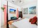 Bedroom boasts a four-poster bed, a TV, and unique decorations at 4098 Lana Ave, Davenport, FL 33897