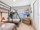 Bedroom features bunk beds, a double bed, and a flat-screen television for entertainment at 4098 Lana Ave, Davenport, FL 33897