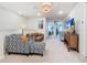 Bright living room area featuring a sofa, love seat, and a television at 4098 Lana Ave, Davenport, FL 33897