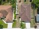 Aerial shot of a well-maintained home with a brown roof and a fenced backyard, highlighting its location at 427 Highland Meadows St, Davenport, FL 33837