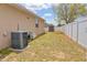 Spacious backyard with a privacy fence, AC unit, and storage shed at 427 Highland Meadows St, Davenport, FL 33837