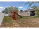 The backyard features a playset with a slide and climbing wall, perfect for Gathering fun and recreation at 427 Highland Meadows St, Davenport, FL 33837