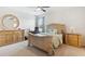 Bright bedroom featuring neutral walls, a ceiling fan, and matching wood furniture with a mirror above the dresser at 427 Highland Meadows St, Davenport, FL 33837