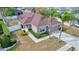 This exterior view showcases a well-maintained home with mature landscaping, an attached garage, and a manicured lawn at 427 Highland Meadows St, Davenport, FL 33837