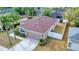 This exterior view shows a single-Gathering home with an attached garage, fenced backyard, and well-maintained landscaping at 427 Highland Meadows St, Davenport, FL 33837