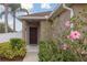 Inviting front entrance with a stylish door, manicured landscaping, and a 'Welcome' doormat at 427 Highland Meadows St, Davenport, FL 33837