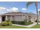 Well-maintained single-Gathering home with a two-car garage, beautiful landscaping, and a welcoming front yard at 427 Highland Meadows St, Davenport, FL 33837