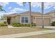 Inviting single-Gathering home with a two-car garage, beautiful landscaping, and a covered front entry at 427 Highland Meadows St, Davenport, FL 33837