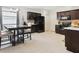 Modern kitchen features espresso cabinets, stainless steel appliances, and an adjacent dining area at 427 Highland Meadows St, Davenport, FL 33837