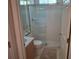 Compact bathroom with a shower behind glass doors, toilet, and vanity at 450 Morning Blossom Ln, Oviedo, FL 32765