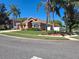 Well-maintained front yard with lush lawn, mature trees, and charming landscaping at 450 Morning Blossom Ln, Oviedo, FL 32765