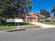 Well-maintained front yard with lush lawn, mature trees, and charming landscaping at 450 Morning Blossom Ln, Oviedo, FL 32765