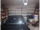 A spacious garage with shelving provides ample storage space for vehicles and belongings at 450 Morning Blossom Ln, Oviedo, FL 32765