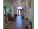 Bright hallway with tile flooring that leads to the front door, filled with natural light at 450 Morning Blossom Ln, Oviedo, FL 32765