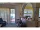 Living room with open concept, patio access, and bright, neutral walls at 450 Morning Blossom Ln, Oviedo, FL 32765