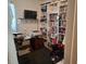 Home office with built-in bookshelves, desk, and natural light at 450 Morning Blossom Ln, Oviedo, FL 32765