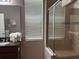 Bright bathroom featuring natural light, double sinks, granite counter, fluffy white towels, and large shower at 457 Bridgeford Crossing Blvd, Davenport, FL 33837
