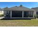 Enjoy a tranquil outdoor space in a screened patio, ideal for relaxing or entertaining at 457 Bridgeford Crossing Blvd, Davenport, FL 33837