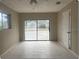 A well-lit bedroom featuring a large sliding glass door, enhancing natural light and views at 4736 Southold St, Orlando, FL 32808