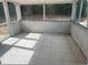 Enclosed patio with tile flooring and screened windows at 4736 Southold St, Orlando, FL 32808