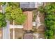 Birds eye view of a home featuring a driveway, well-kept landscape, and mature trees at 4800 Beacon St, Orlando, FL 32808