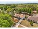 Aerial view of a well-maintained home, mature trees, and a long driveway at 4800 Beacon St, Orlando, FL 32808