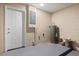 Unfinished basement featuring concrete block walls, a painted floor and access to the exterior at 4800 Beacon St, Orlando, FL 32808