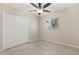 Spacious bedroom with tile floors, ceiling fan, closet and window is move-in ready at 4800 Beacon St, Orlando, FL 32808