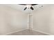 Spacious bedroom with tile floors and ceiling fan has easy access to the adjacent room at 4800 Beacon St, Orlando, FL 32808