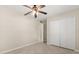 Spacious bedroom with tile floors, ceiling fan and closet is move-in ready at 4800 Beacon St, Orlando, FL 32808