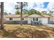 Charming single-story home featuring a brick-accented facade, a well-maintained lawn, and a cozy front porch at 4800 Beacon St, Orlando, FL 32808