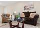 Comfortable living room with stylish decor, a glass coffee table, and a painting adding a touch of elegance at 4800 Beacon St, Orlando, FL 32808