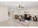 Bright living room featuring tile flooring, a ceiling fan, and a sliding glass door leading to the outdoors at 4800 Beacon St, Orlando, FL 32808