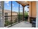 Spacious outdoor balcony offers a spot for relaxing with serene views of the neighboring building at 501 Mirasol Cir # 519, Celebration, FL 34747