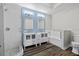 Bright bathroom with double vanity, modern fixtures, and a tiled walk-in shower and soaking tub at 501 Mirasol Cir # 519, Celebration, FL 34747