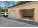 Garage for parking with a car parked out front; the garage is well lit with a closed and open door at 501 Mirasol Cir # 519, Celebration, FL 34747
