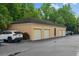 Car parked in front of a row of garages with a neutral exterior and brown roofing in a neighborhood at 501 Mirasol Cir # 519, Celebration, FL 34747