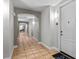 Hallway with tile flooring, arched entryway, neutral paint and door that leads to apartment 519 at 501 Mirasol Cir # 519, Celebration, FL 34747