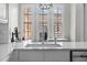 Close-up of a kitchen countertop with sink and modern fixtures, showcasing the clean design at 501 Mirasol Cir # 519, Celebration, FL 34747