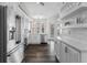 Bright kitchen with stainless steel appliances, white cabinetry, and plenty of natural light at 501 Mirasol Cir # 519, Celebration, FL 34747
