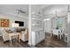 Stylish living room with sleek furniture, modern lighting, and an open layout to the dining area at 501 Mirasol Cir # 519, Celebration, FL 34747
