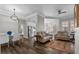 Bright living room and dining area featuring hardwood floors, modern decor, and ample natural light at 501 Mirasol Cir # 519, Celebration, FL 34747