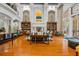 Elegant lobby with hardwood floors, high ceilings, a fireplace and staircase to the second floor at 501 Mirasol Cir # 519, Celebration, FL 34747