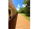 Wooden deck with views of the backyard, accessed through sliding glass doors from the home at 532 Madison Ave, Orlando, FL 32805