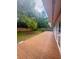 Wide wood deck overlooks a grassy backyard with trees and a wooden privacy fence at 532 Madison Ave, Orlando, FL 32805